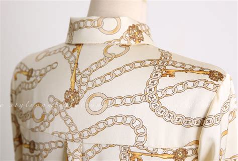 white blouse with gold chain print chanel